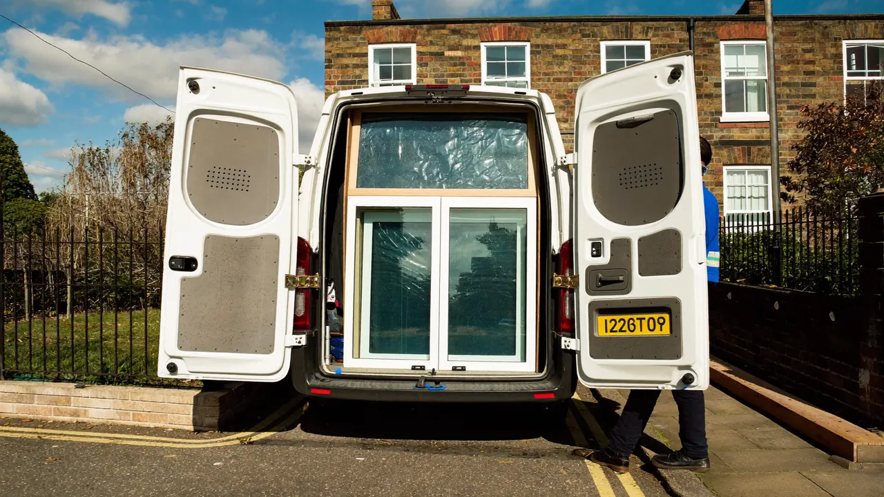 Installer van loaded with new window frames ready for fitting